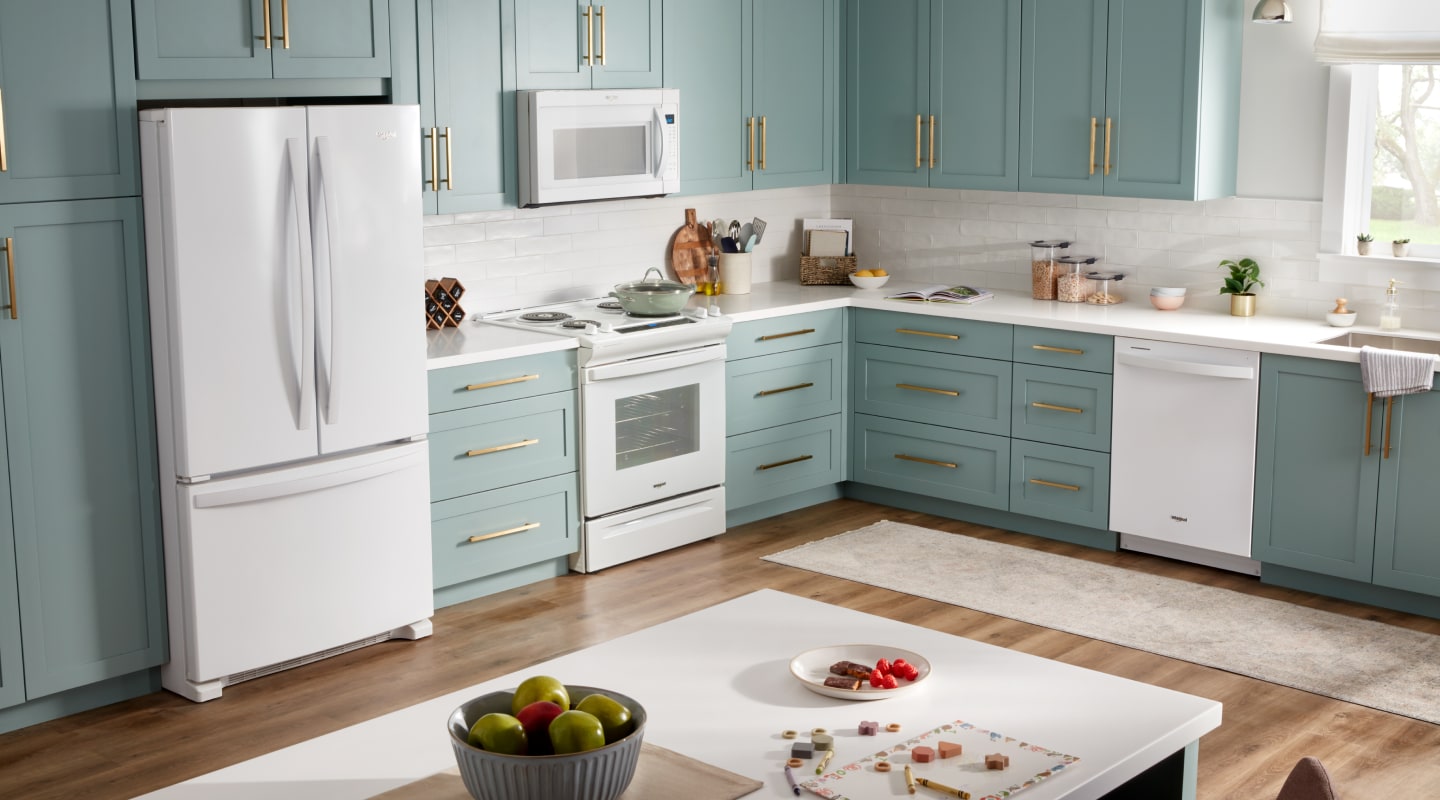 A Whirlpool® French Door Refrigerator with Bottom Freezer in a kitchen setting  A Whirlpool® French Door Refrigerator with Bottom Freezer in a kitchen setting
